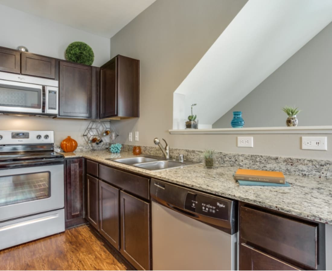 Classically furnished kitchen in a model luxury apartment at Parkside Towns in Richardson, Texas