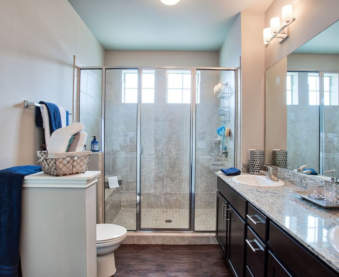 Tile shower and upgraded bathrooms at Parkside Towns in Richardson, Texas