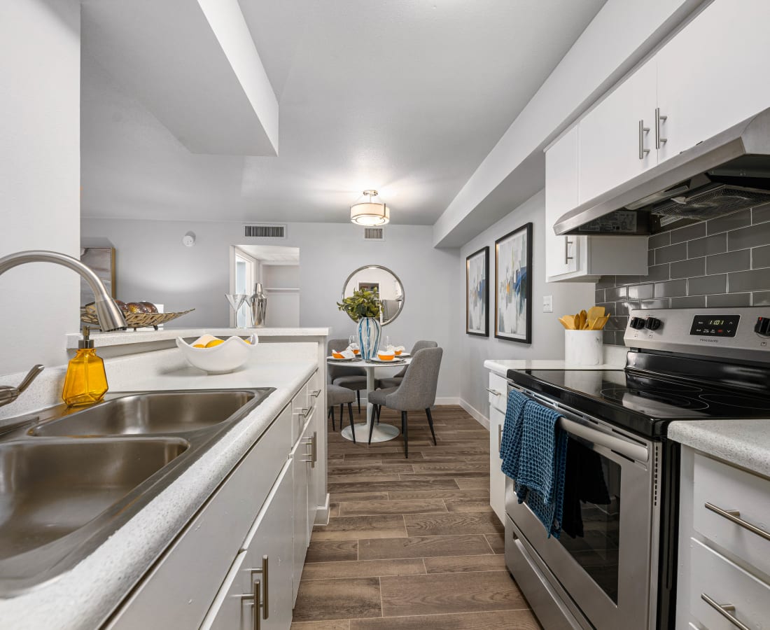Model kitchen space with modern amenities at Villetta in Mesa, Arizona