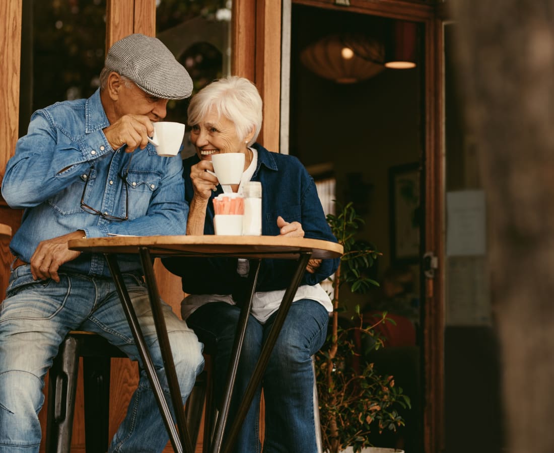 Happy couple drinking coffee near Fielder's Glen in Arlington, Texas