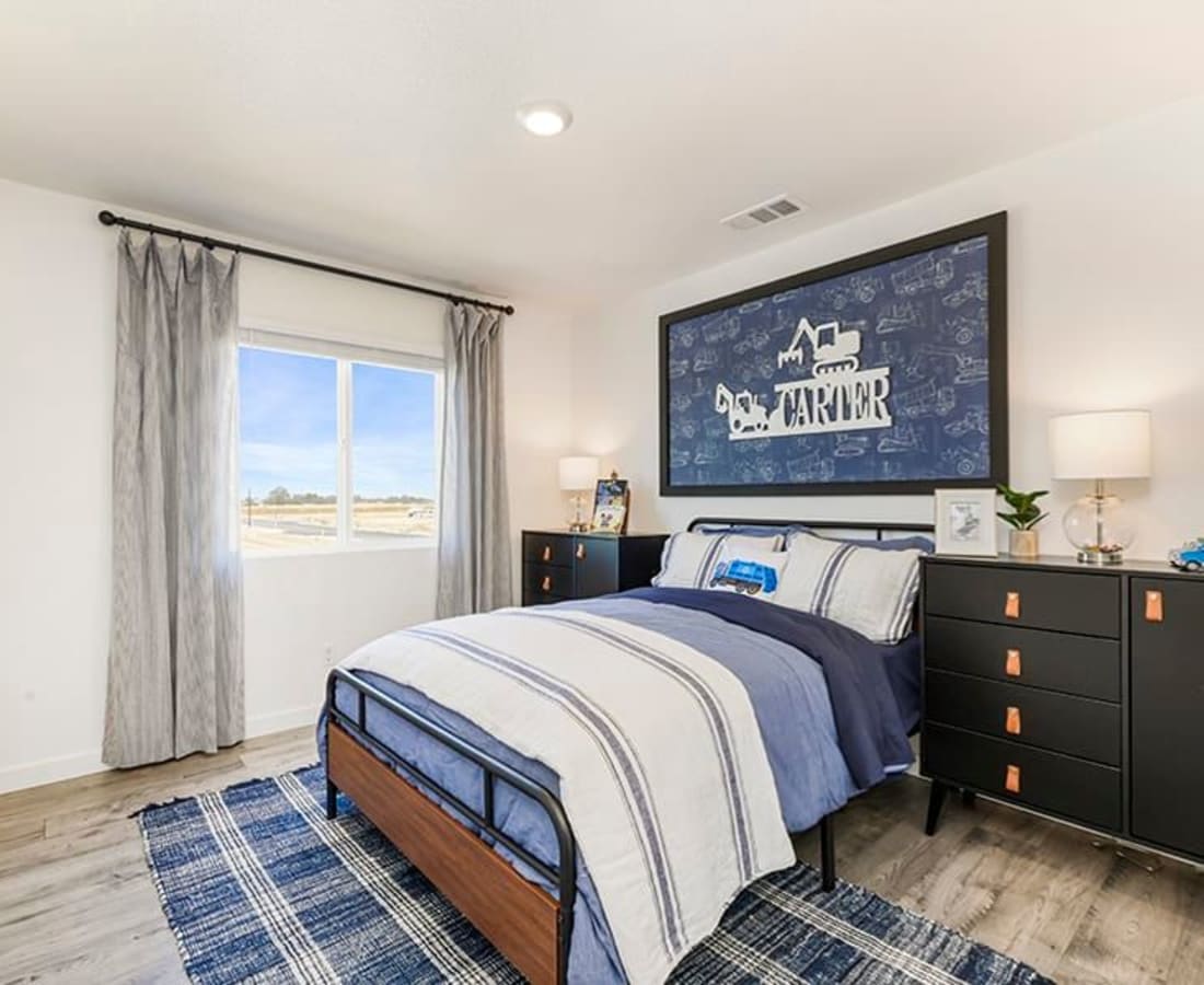 Bedroom with large windows at Isles in Roseville, California