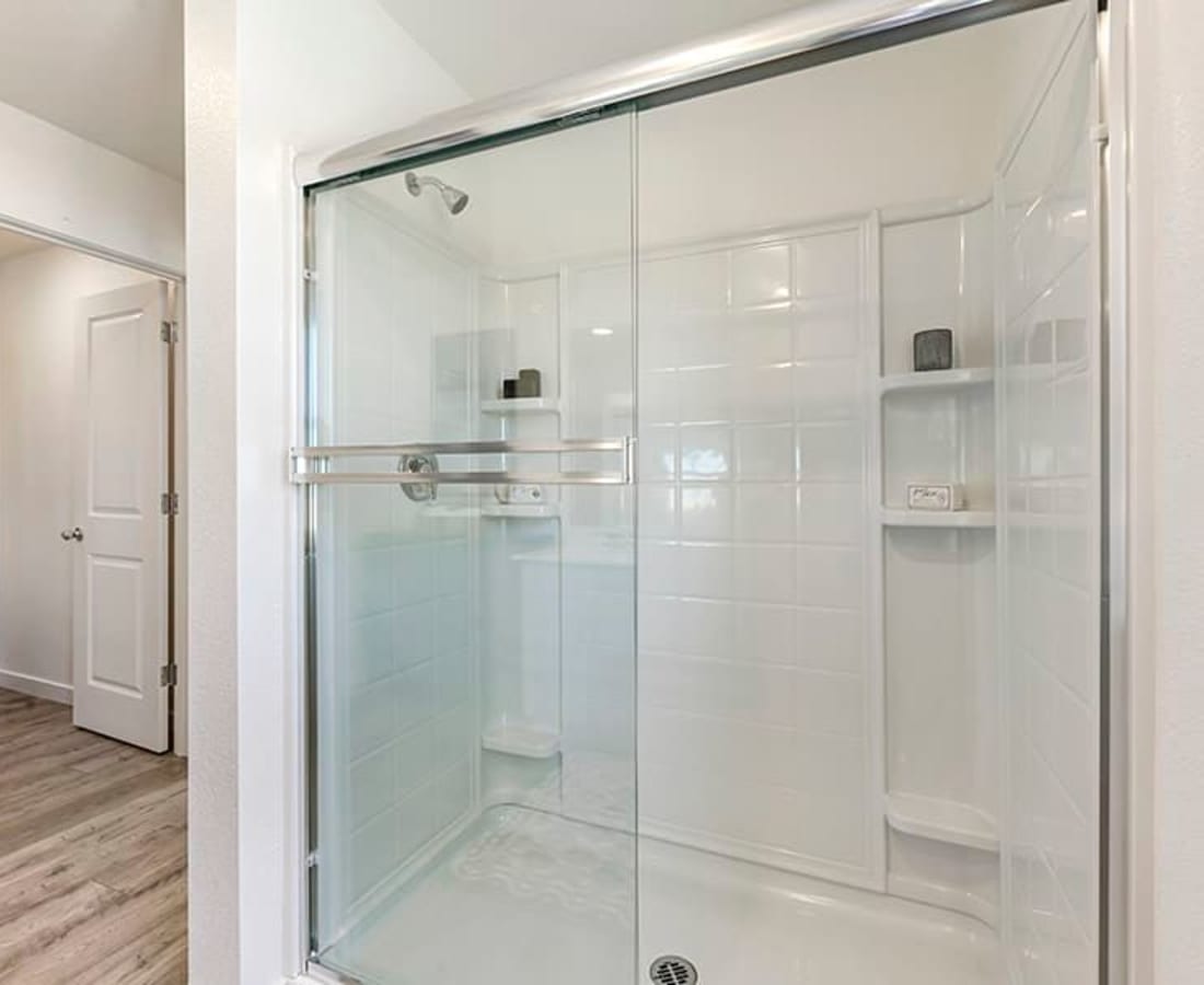 Shower with glass doors at Isles in Roseville, California