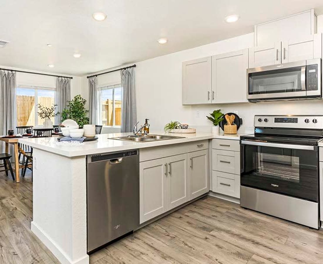 Kitchen with stainless-steel appliances at Isles in Roseville, California