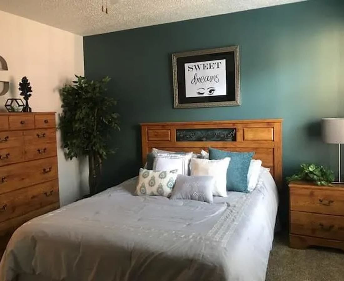 Furnished model bedroom at High Range Village in Las Cruces, New Mexico