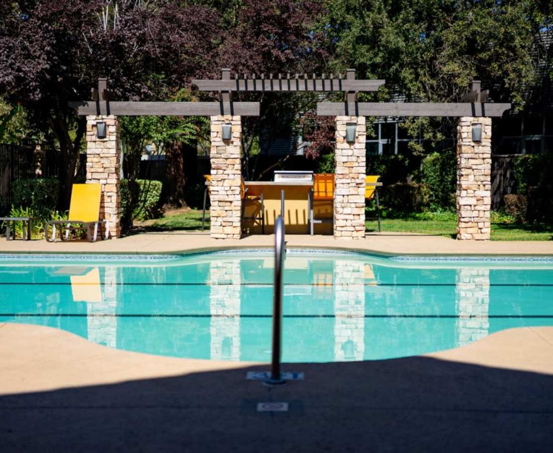Swimming pool at Oak Brook Apartments in Rancho Cordova, California
