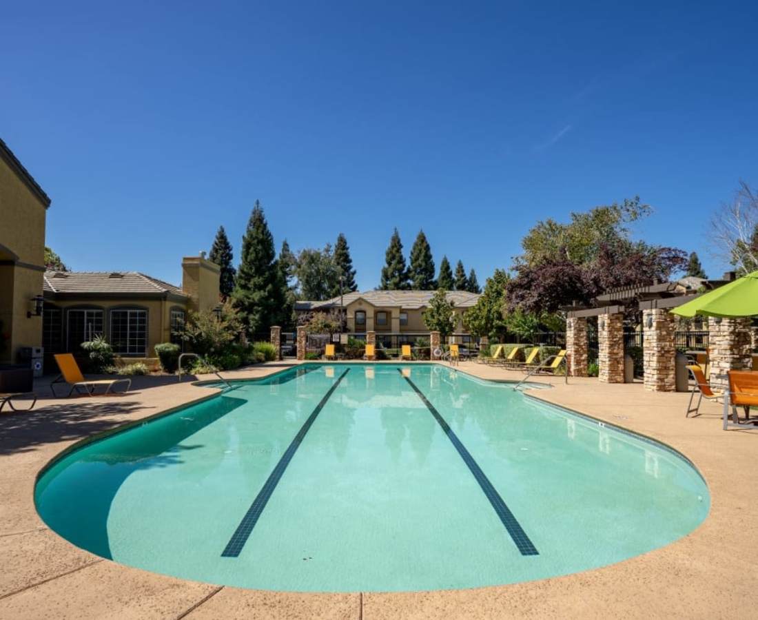 Large swimming pool at Oak Brook Apartments in Rancho Cordova, California