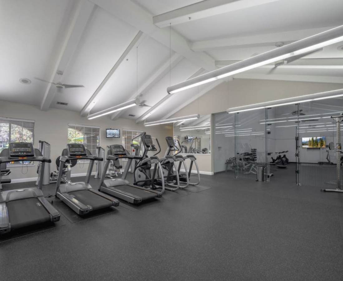 Spacious fitness center at Oak Brook Apartments in Rancho Cordova, California