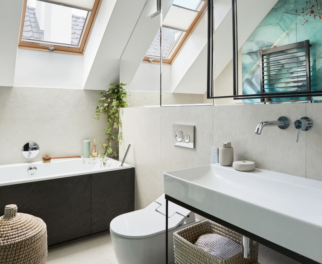 Skylight and tiled walls in a model home's modern bathroom at The Fitz Apartments in Dallas, Texas