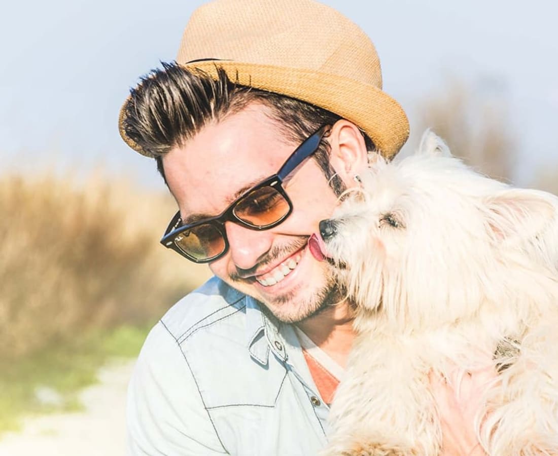 Happy man holding his dog at Hidden Creek in Vacaville, California