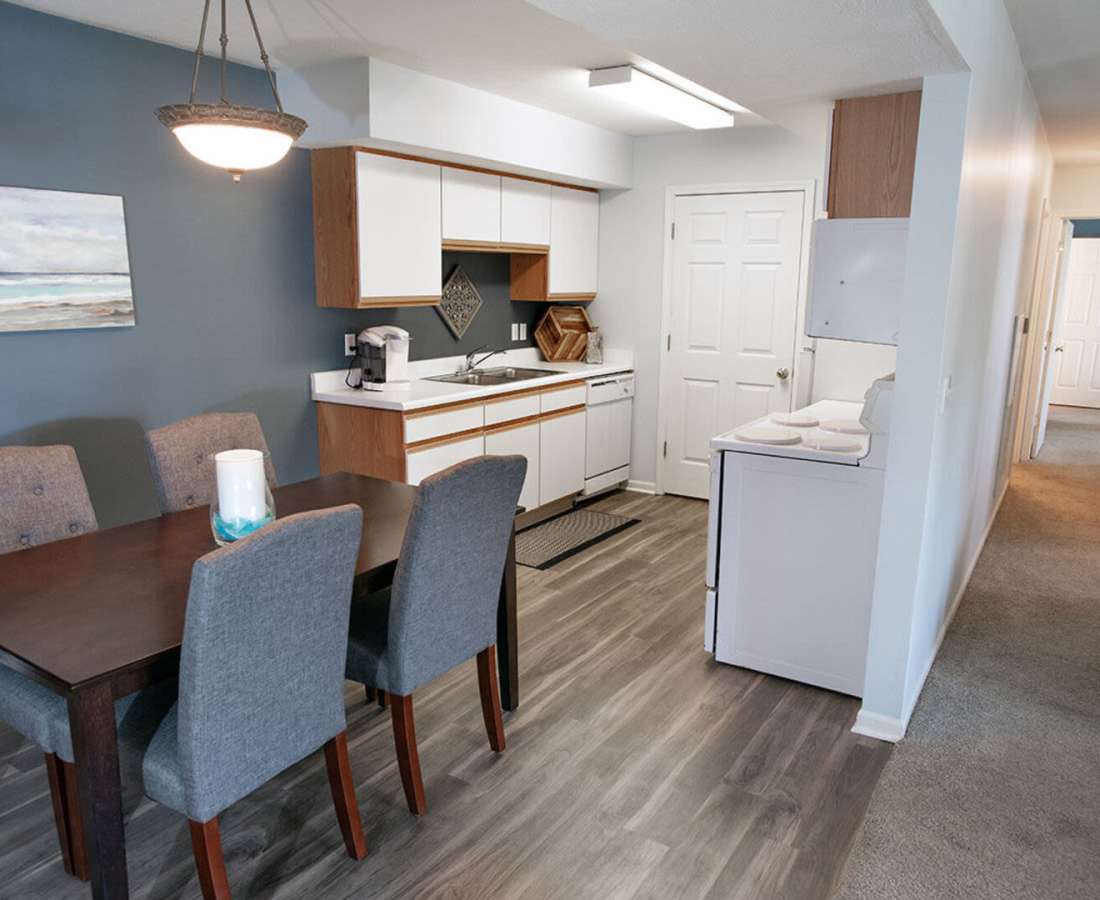 Modern decor in the dining area of a model home at Hamptons of Norton Shores in Norton Shores, Michigan