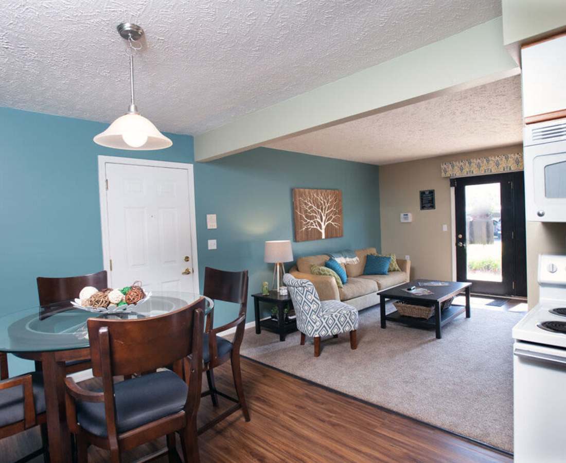 Modern furnishings in a model home's living space at Victoria Pointe Apartments in Jackson, Michigan