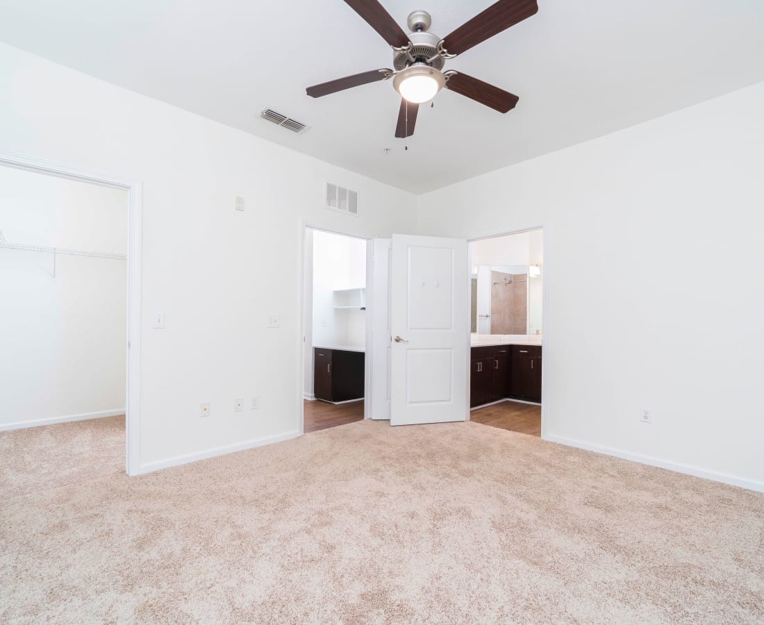 Carpeted bedroom with ceiling fan at Terraces at Town Center in Jacksonville, Florida