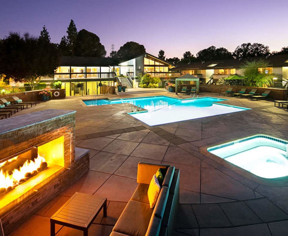 Firepit lit at night by the pool at Stoneridge Luxury in Walnut Creek, California