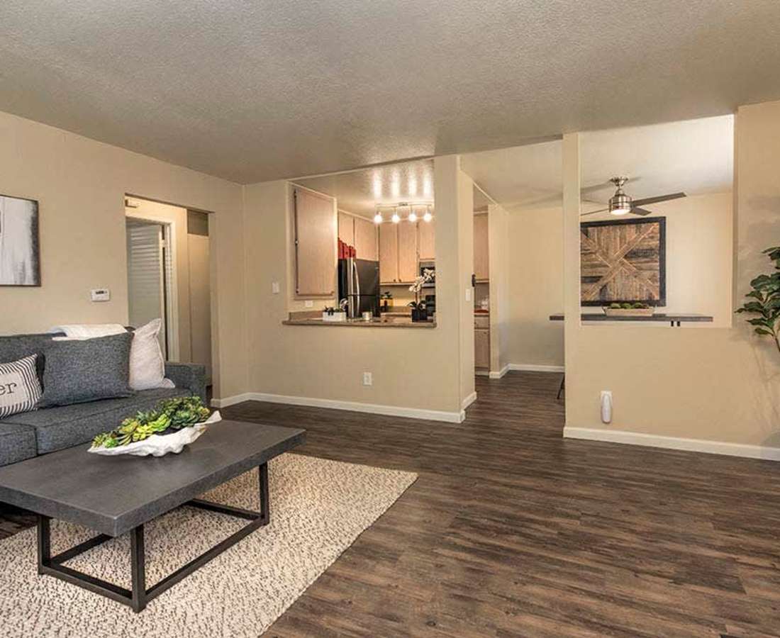 Living room with wood-style flooring at Foxborough in Citrus Heights, California