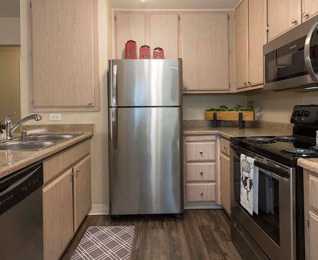 Kitchen with stainless-steel appliances at Foxborough in Citrus Heights, California