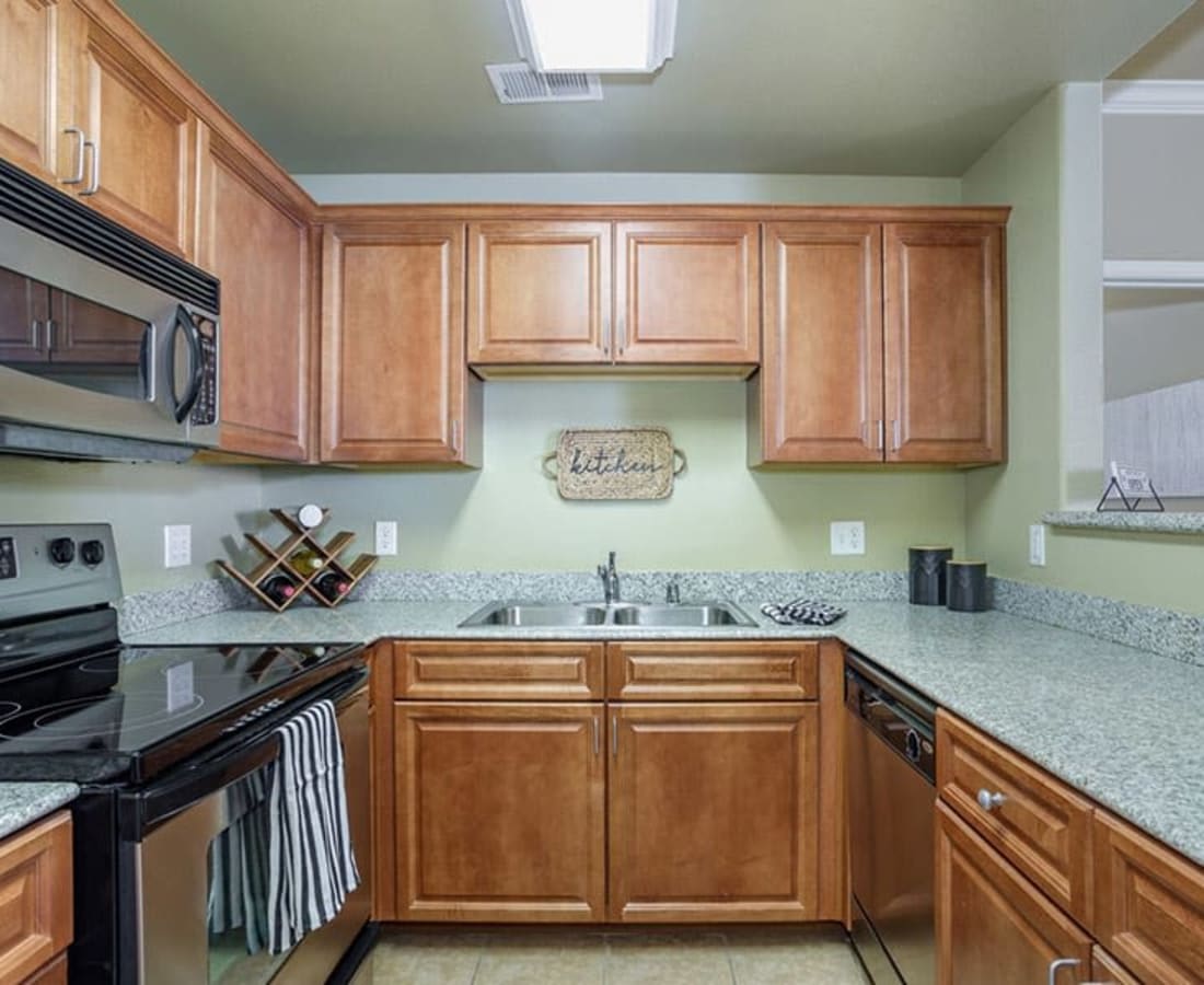 Kitchen with appliances and cabinets at Castellino at Laguna West in Elk Grove, California