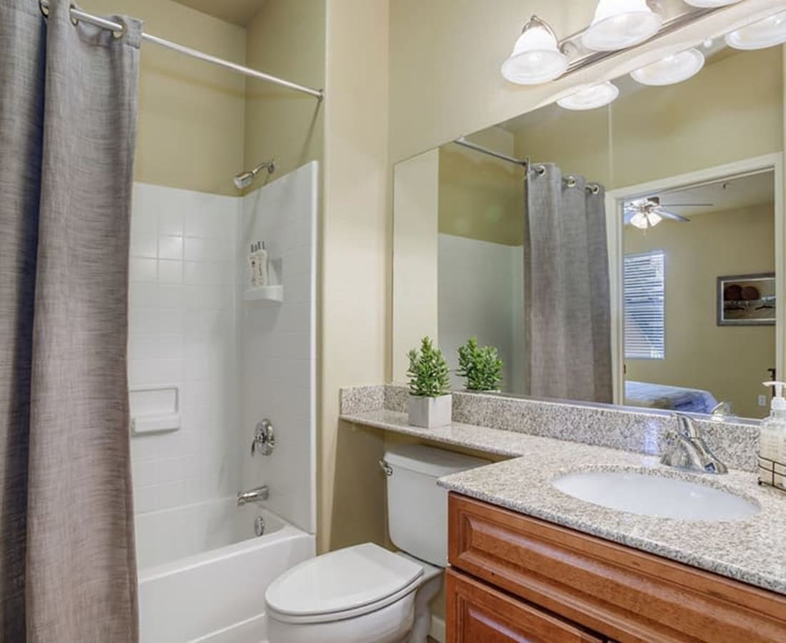 Bathroom with a large mirror at Castellino at Laguna West in Elk Grove, California