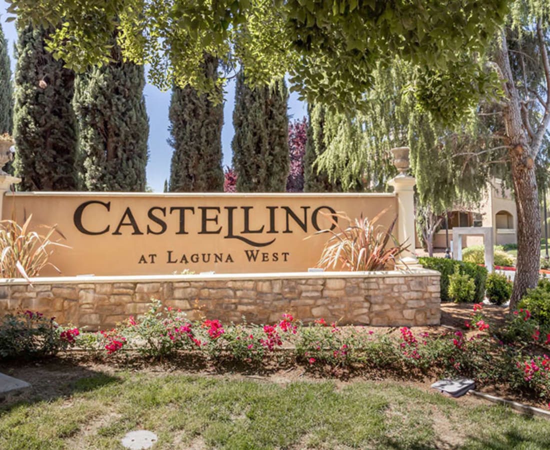 Lush landscaping  and apartment sign at Castellino at Laguna West in Elk Grove, California