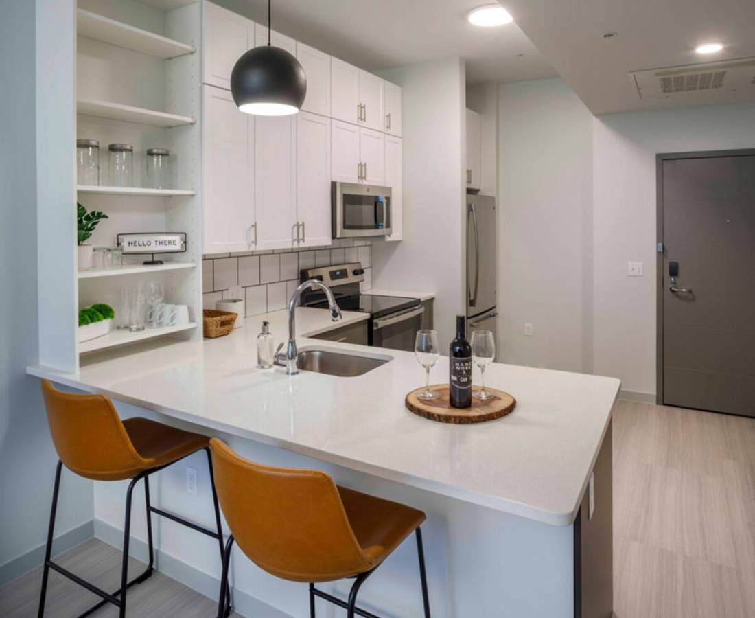 Modern furnishings in a model home's living space at BLOCK600 Lofts in Lansing, Michigan