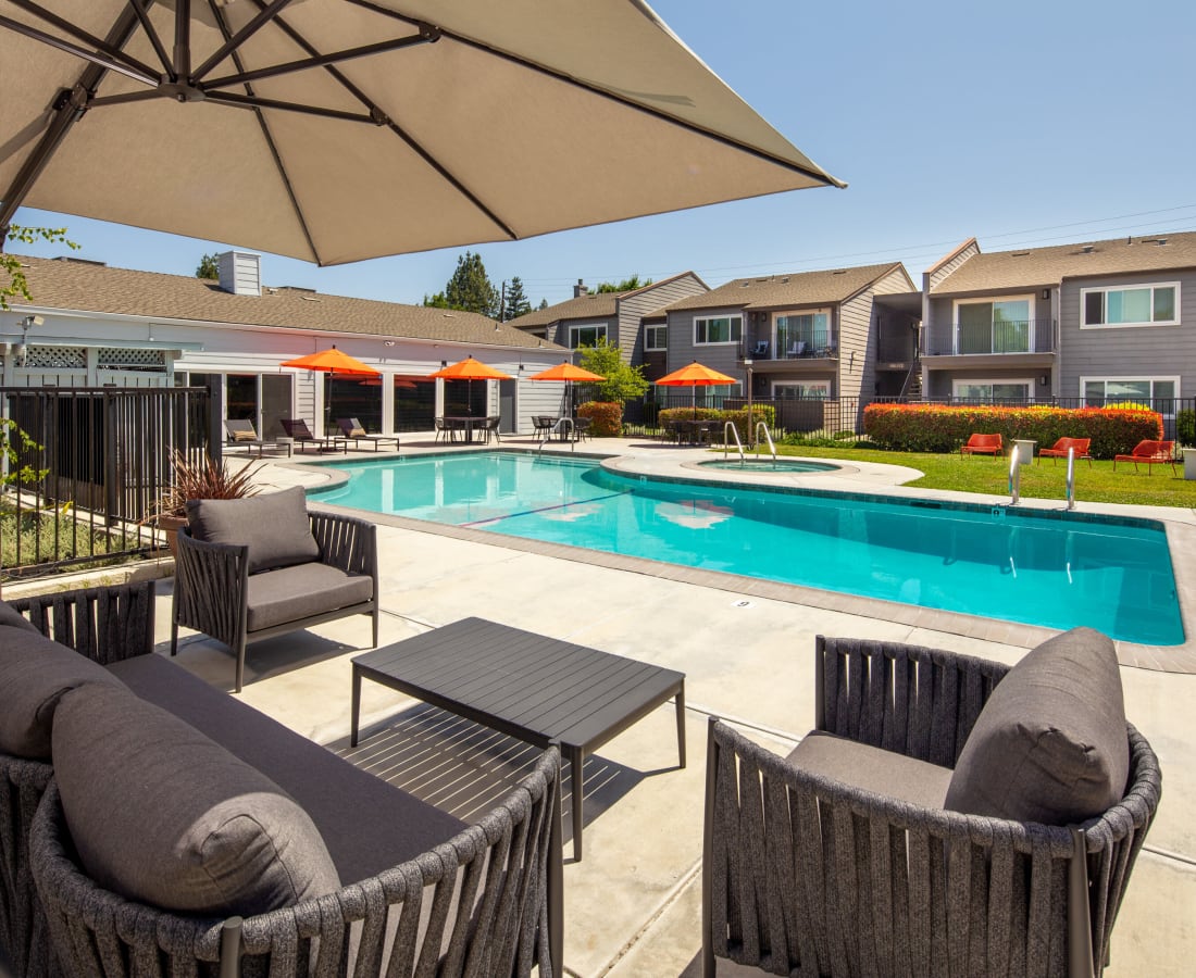 Lounge seating by the pool at The Edge in Modesto, California