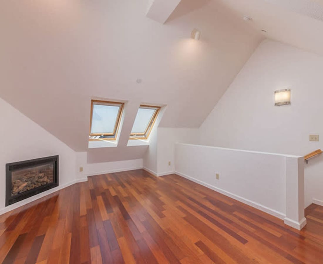 Model living room with hardwood floors at Clay Street Residences in Santa Cruz, California