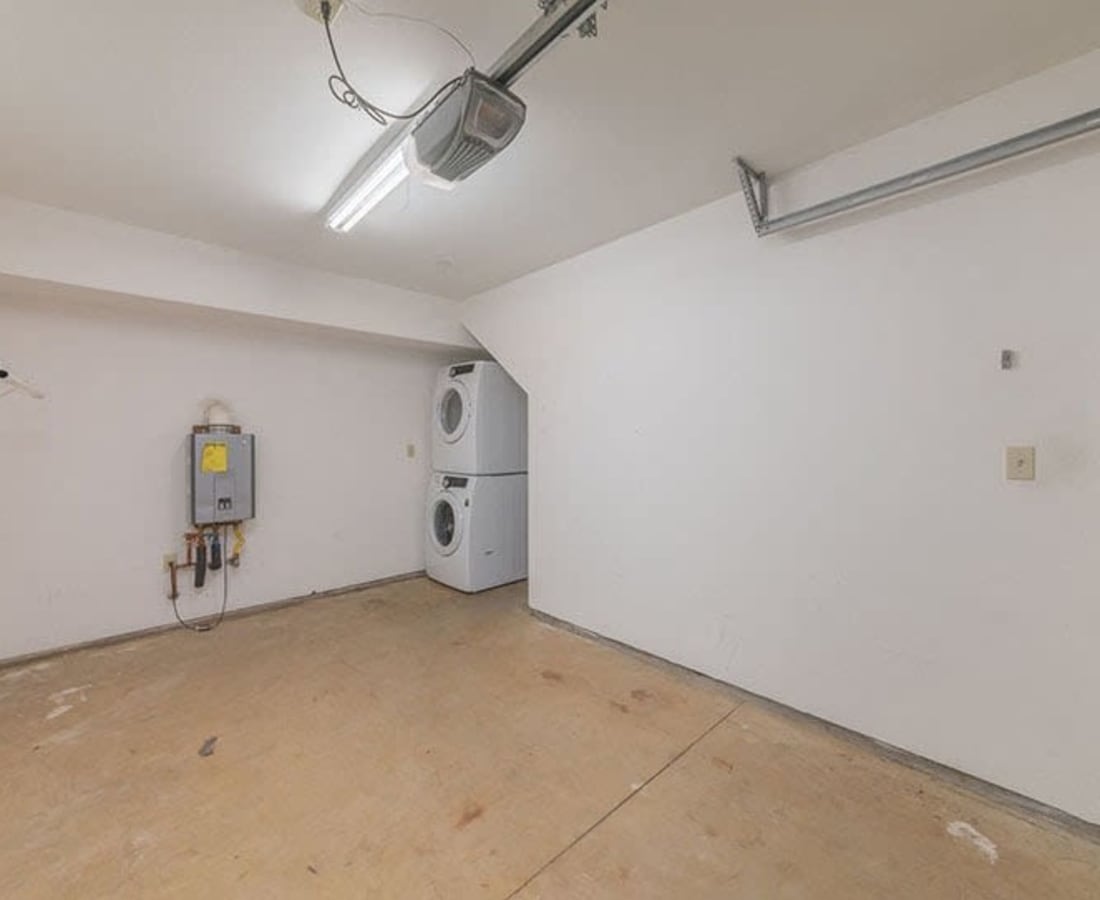 Empty garage with washer and dryer at Clay Street Residences in Santa Cruz, California