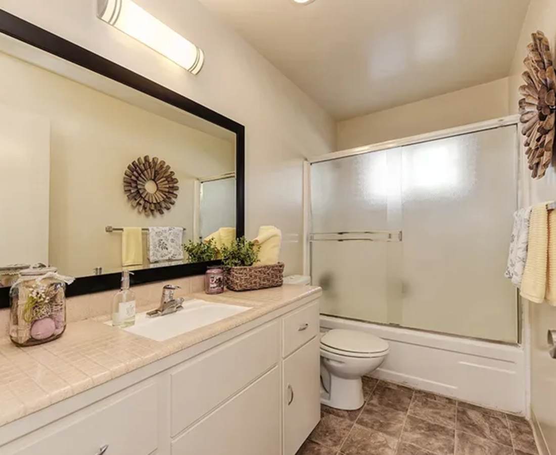 Bathroom with a large counter at Cherry Blossom Apartments in Sunnyvale, California