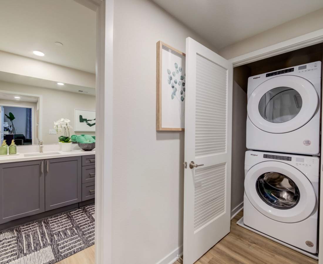 Vanity and Laundry area with built-in washer and dryer available at Aviara at Mountain House in Mountain House, California