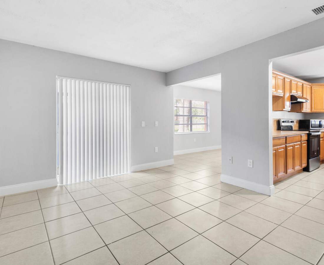 Apartment with access to private patio and tile flooring at Palm Bay Club in Palm Bay, Florida