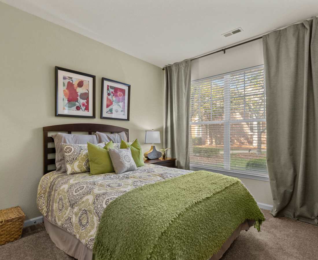 Bedroom with large windows at Preserve at Steele Creek in Charlotte, North Carolina