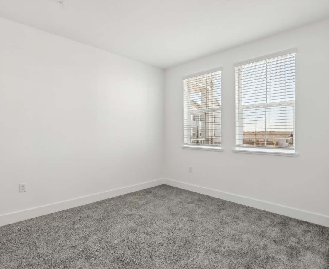 Bedroom with large windows at Prospera at Fiddyment in Roseville, California