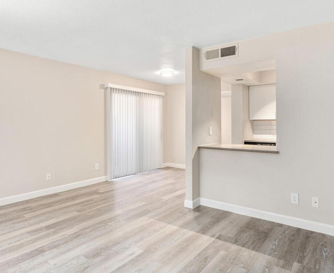 View of bright living room at Raystone Apartments in Phoenix, Arizona