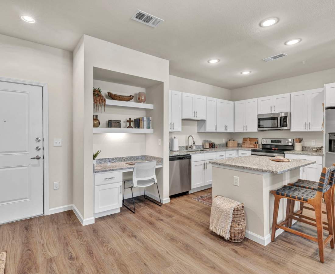 Classically furnished kitchen in a model luxury apartment at Mariposa Communications Parkway in Plano, Texas