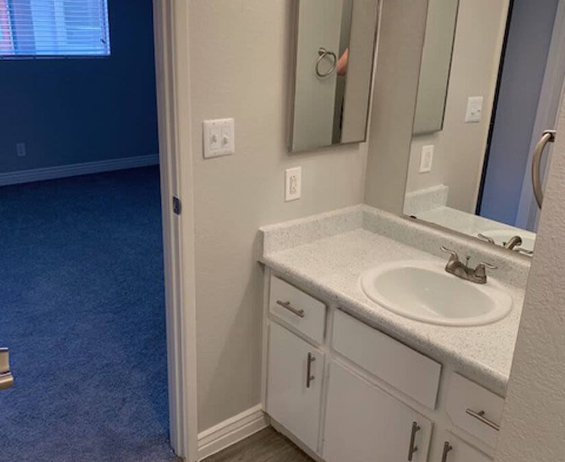 Bright bathroom with quartz countertops and access to bedroom at 544 Southern Apartments in Mesa, Arizona