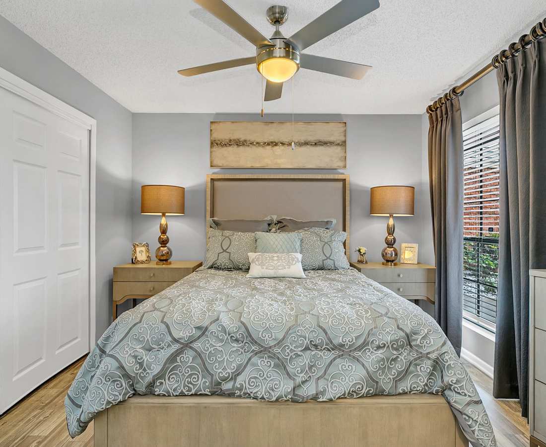 Spacious bedroom with a ceiling fan and a comfortable bed at Rosemont Windermere in Orlando, Florida
