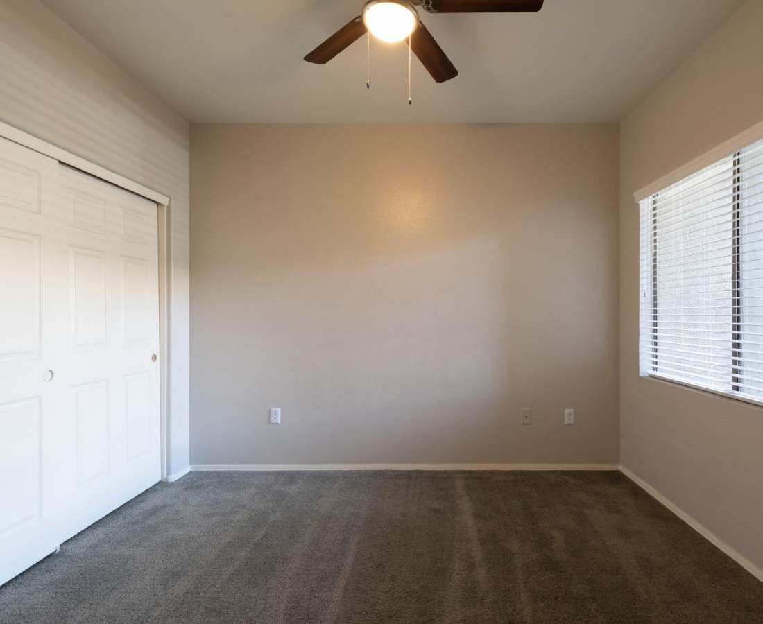 Bedroom with bright windows at Sol District in Phoenix, Arizona