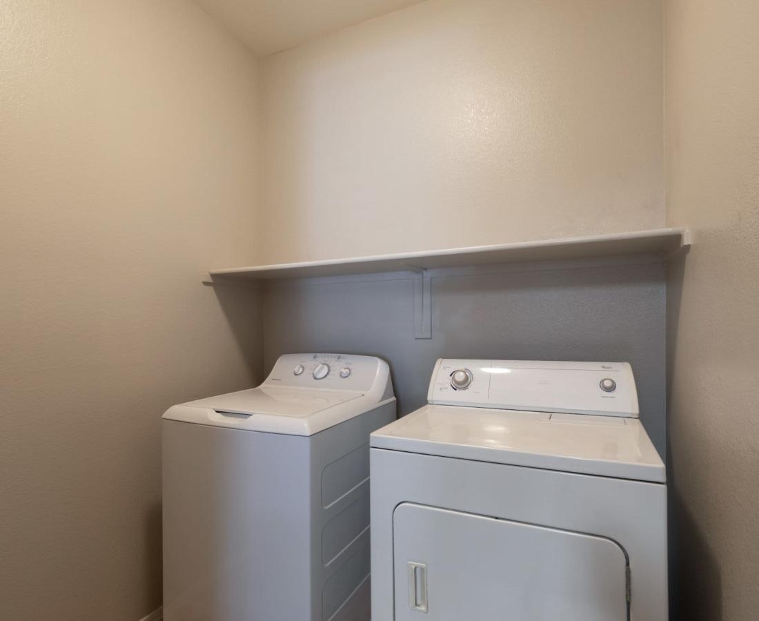 Laundry room with washer and dryer at Sol District in Phoenix, Arizona