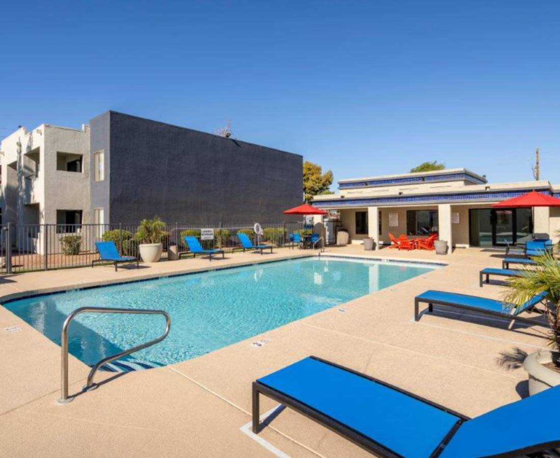 Resort style swimming pool with seating area at Sunpointe in Phoenix, Arizona, 