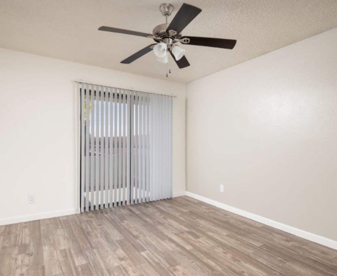 Living room with wood style flooring at Sunpointe in Phoenix, Arizona, 