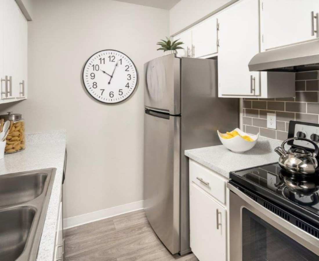 Kitchen with stove,refrigerator and storage at Sunpointe in Phoenix, Arizona, 