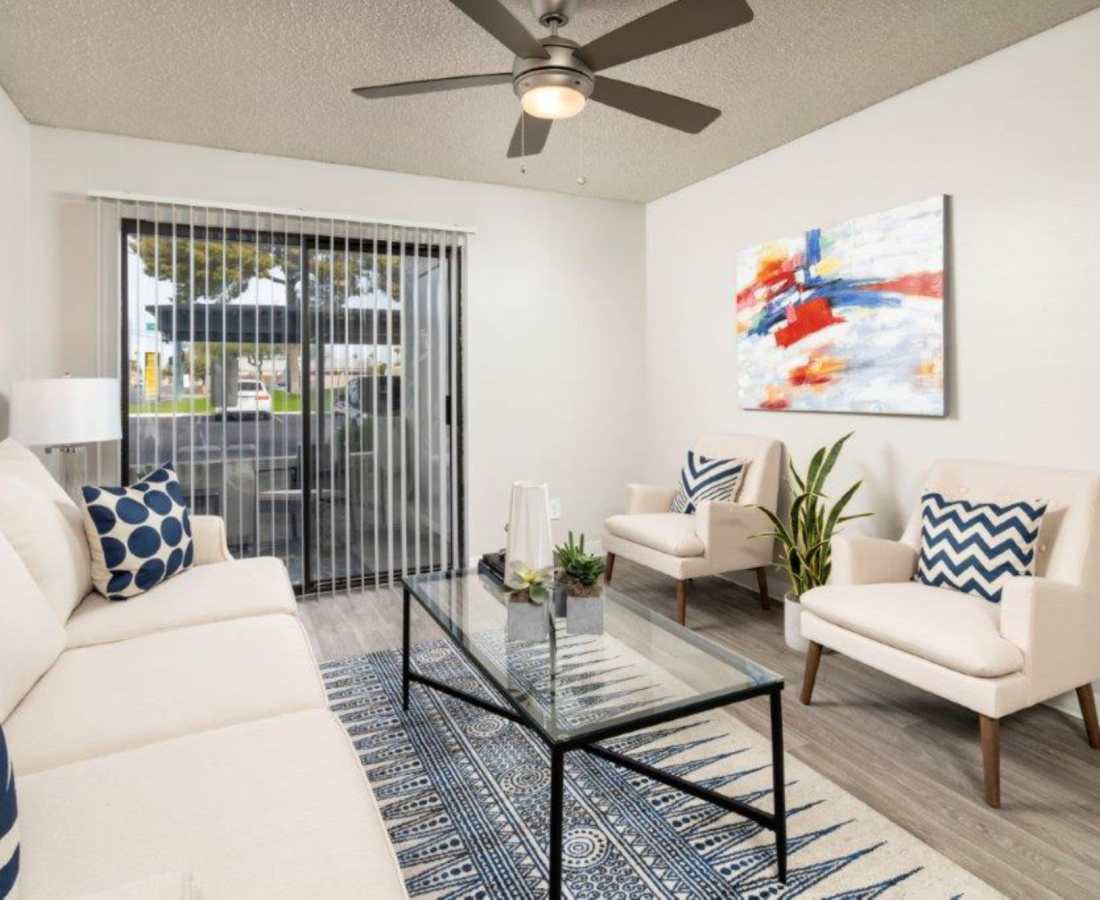 Spacious living room with couch and ceiling fan at Sunpointe in Phoenix, Arizona, 