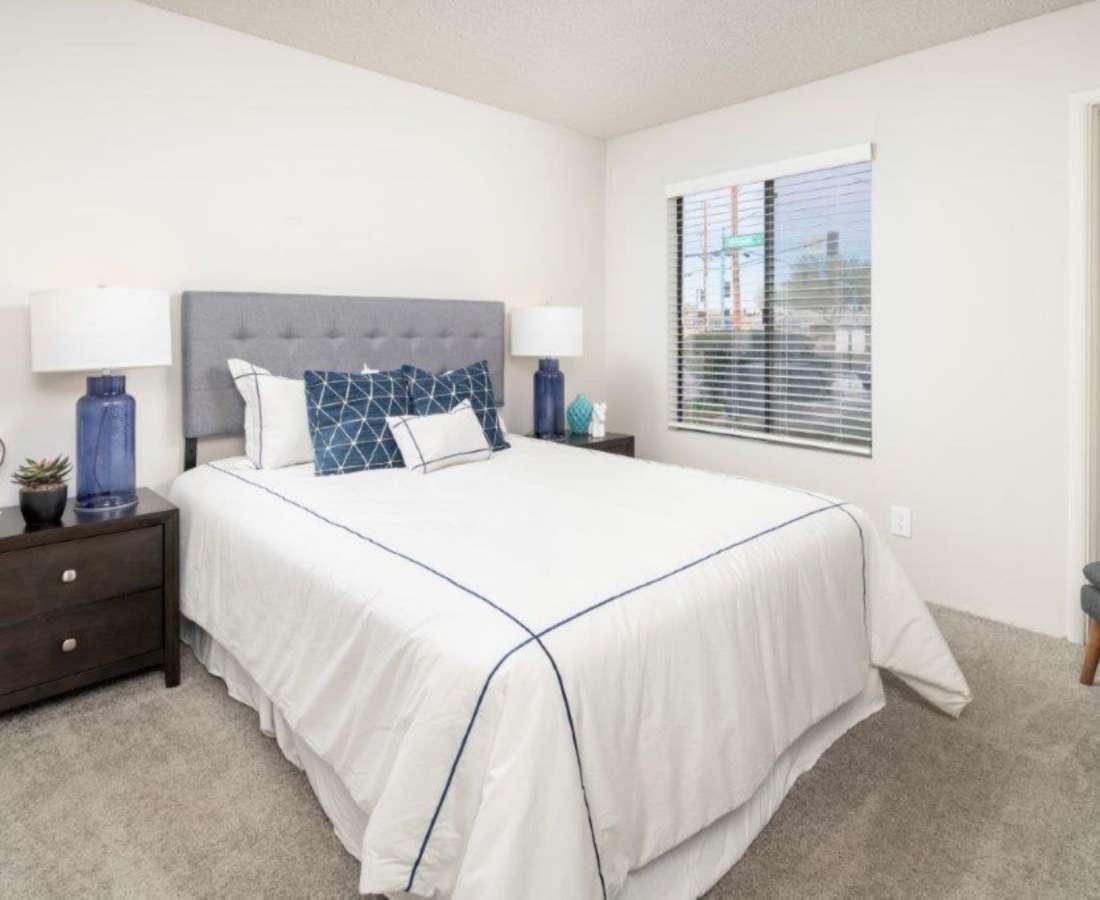 Spacious bedroom with large comfortable bed at Sunpointe in Phoenix, Arizona, 