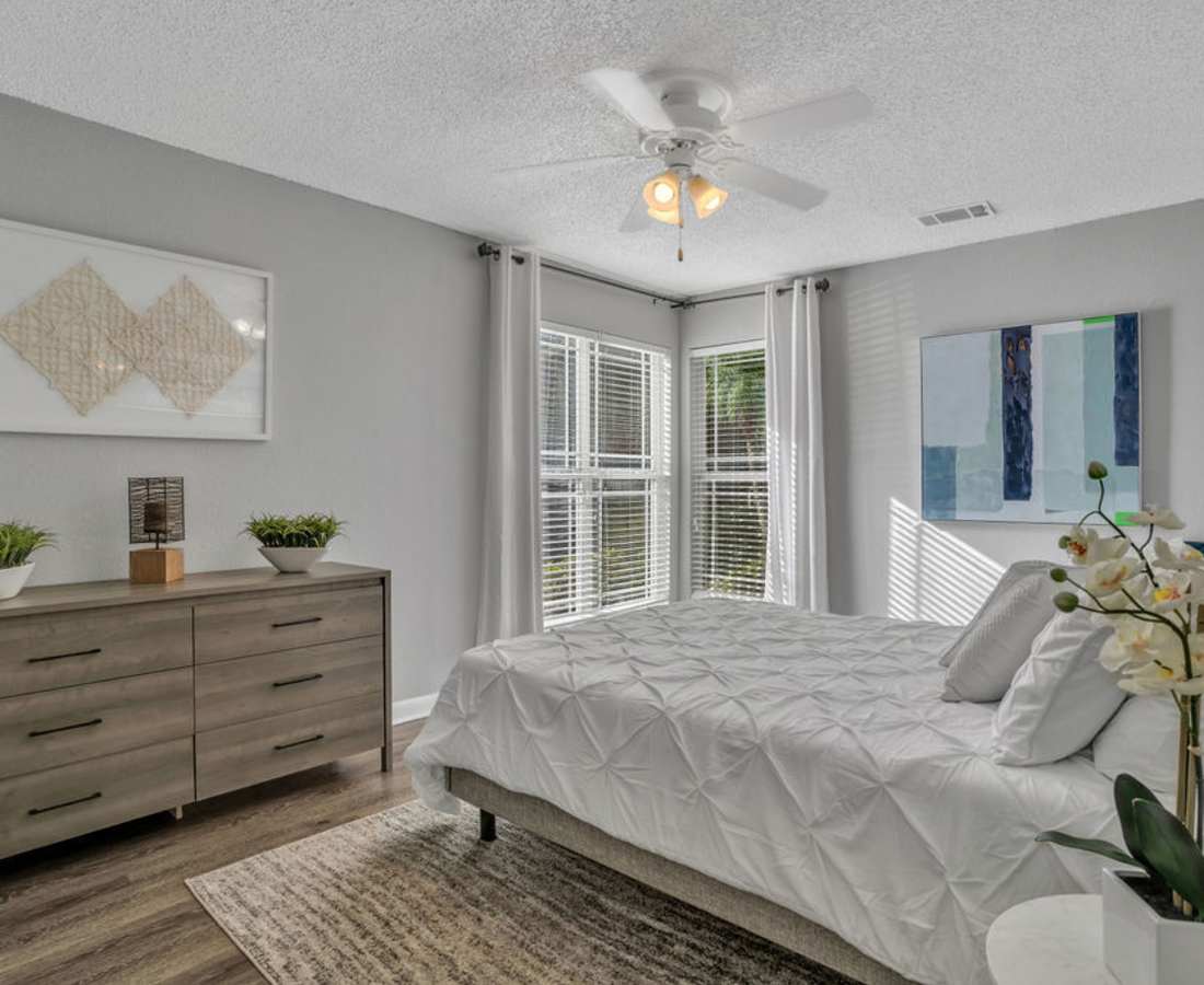 Comfy bedroom at The Canopy Apartment Villas in Orlando, Florida