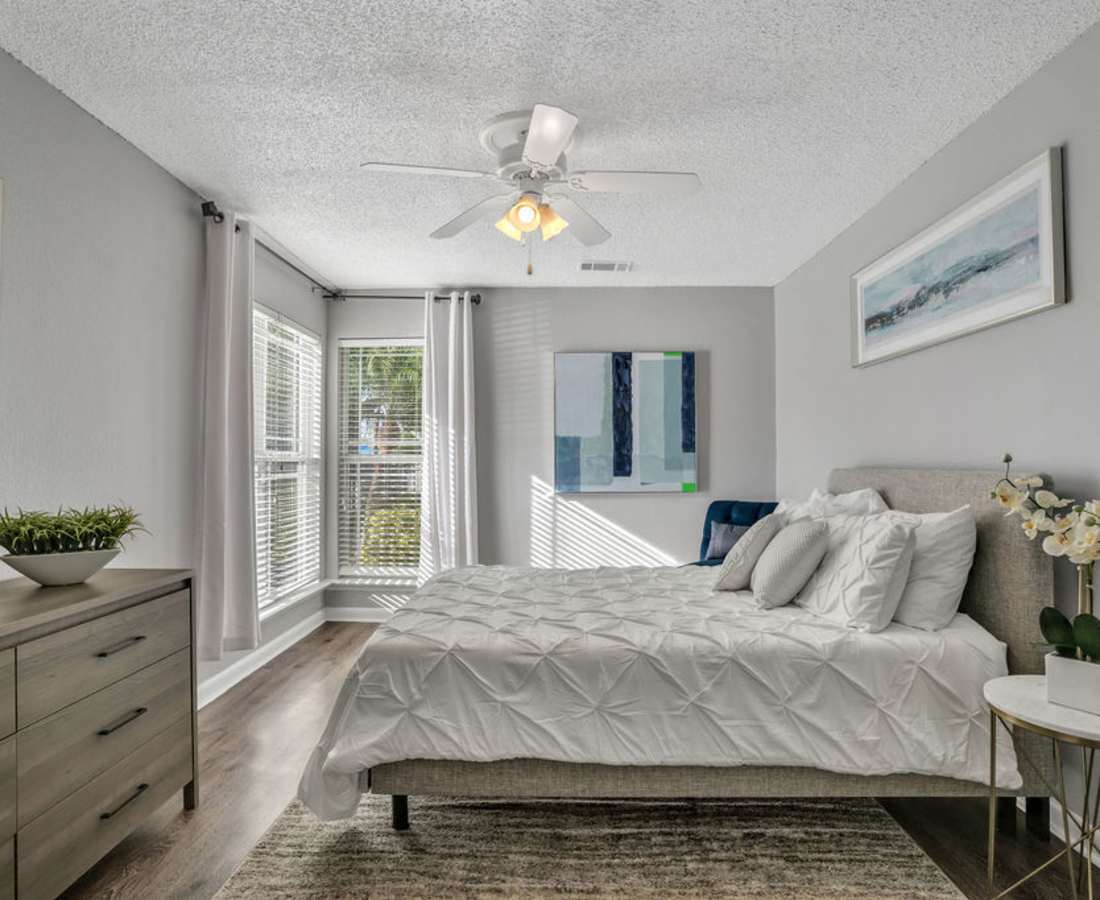 Bedroom with carpets and proper lighting at The Canopy Apartment Villas in Orlando, Florida