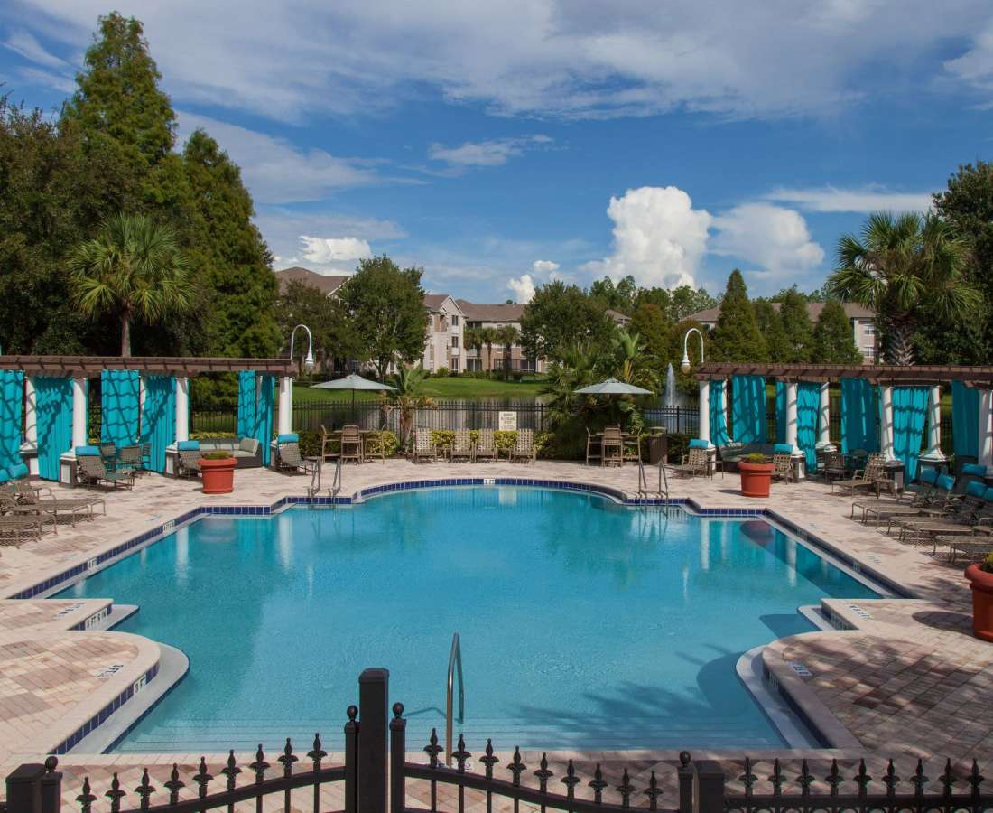 Swimming pool with lounge chair at The Legends At ChampionsGate in ChampionsGate, Florida
