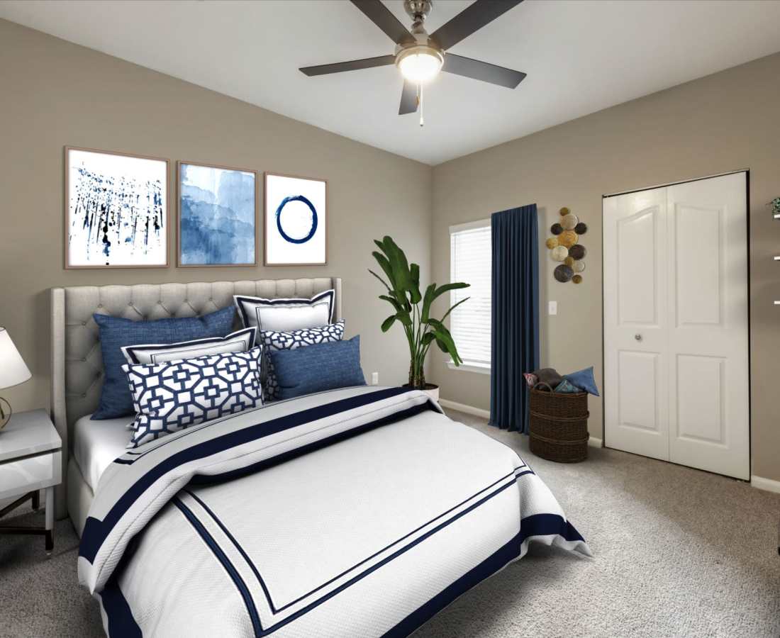 Bedroom with wall art at The Legends At ChampionsGate in ChampionsGate, Florida