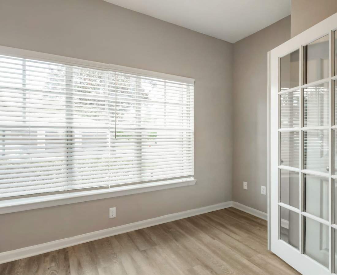 Sunroom with wooden flooring at The Legends At ChampionsGate in ChampionsGate, Florida