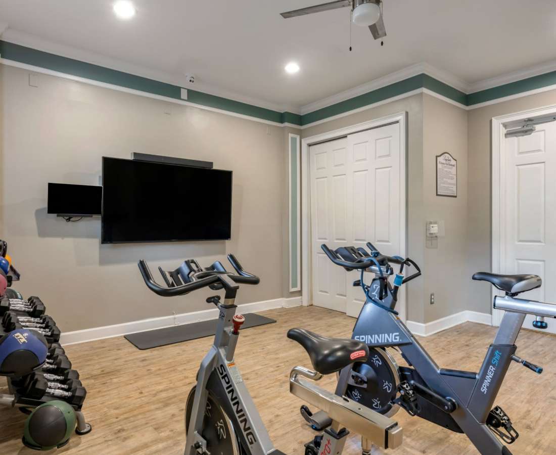 Fitness center with television at The Legends At ChampionsGate in ChampionsGate, Florida