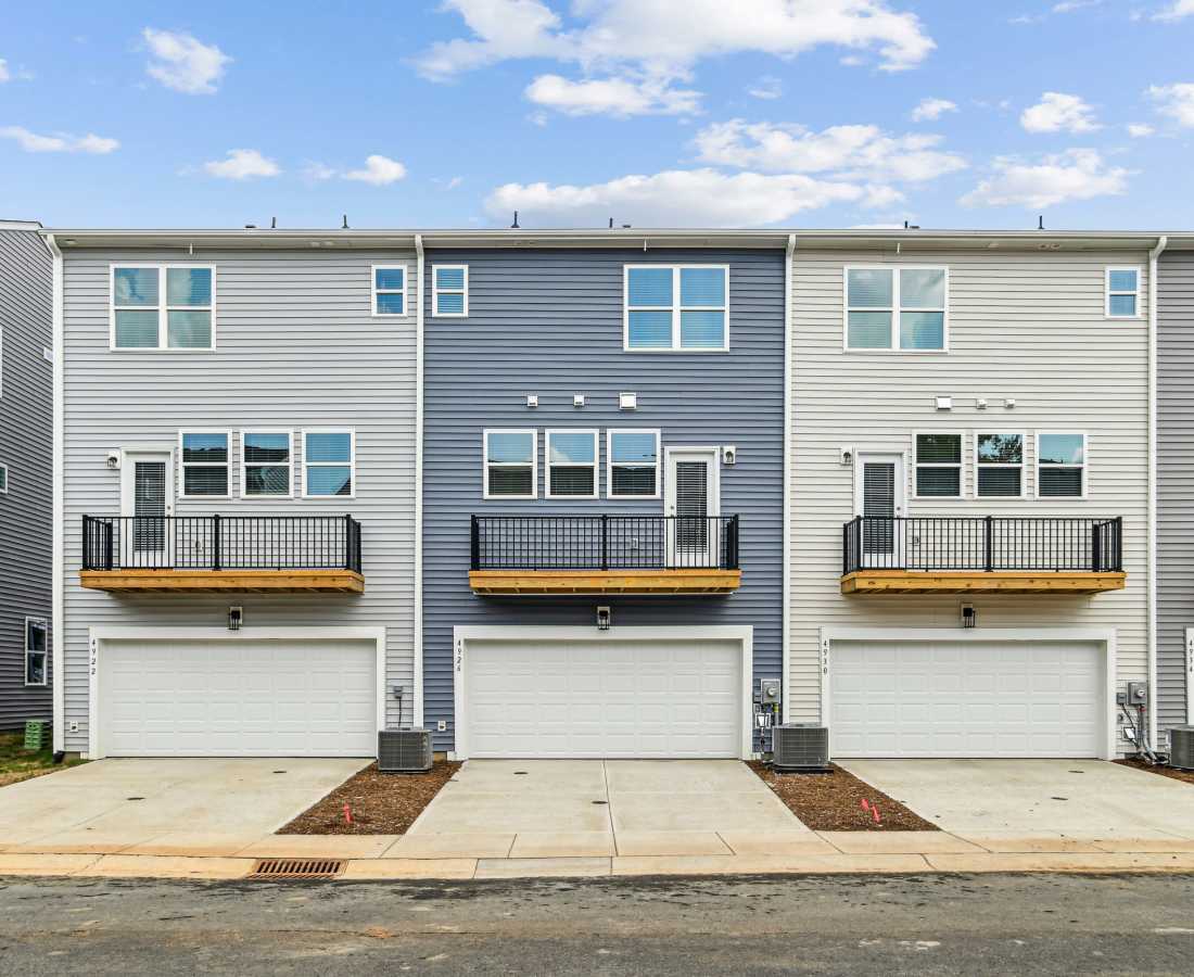 Backside of the apartment with garage space at Westmont Village in Charlotte, North Carolina
