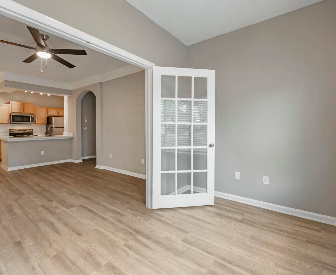 Unfurnished living room with wood-style flooring at The Legends At ChampionsGate in ChampionsGate, Florida